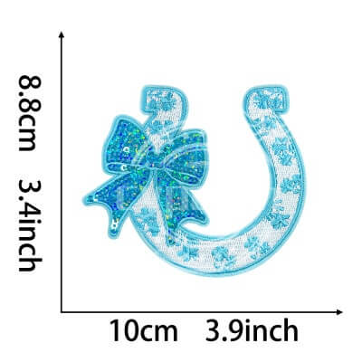 Blue embroidered horseshoe patch with sequin bow and shamrock accents
