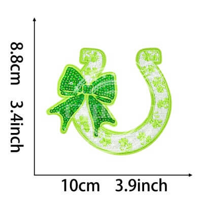 Green embroidered patch in the shape of a horseshoe with bow and shamrock floral details