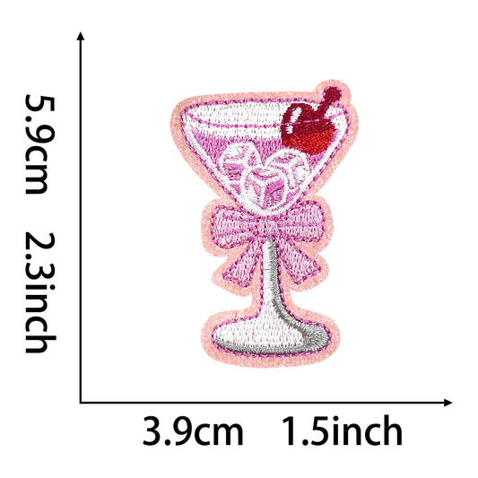 Embroidered pink cocktail glass iron-on patch with cherry, ice, and bow, 5.9cm x 3.9cm