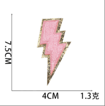 Pink lightning bolt embroidered patch with gold glitter border
